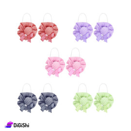 A Pair Of Girl's Hat-Shaped Hair Ties With Squares Pattern