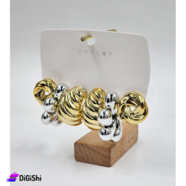 A Set of 3 Pairs of Golden and Silver Earrings in Spiral shapes