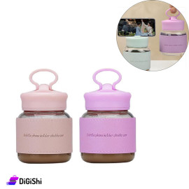 Transparent Glass Cup with Plastic Lid and Piece of Leather